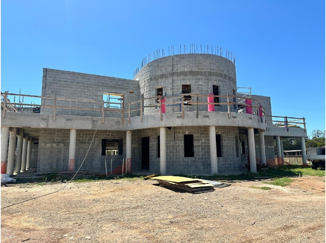 Temple front facade with circular tower